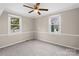 Comfortable bedroom featuring carpet, ceiling fan and natural light at 27 Sw Barbee Rd, Concord, NC 28027