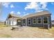 A backyard with a fire pit and covered patio at 4021 Grace Pointe Dr # 104, Wesley Chapel, NC 28079