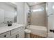 Clean bathroom with tub/shower, modern fixtures, and tile accents at 4021 Grace Pointe Dr # 104, Wesley Chapel, NC 28079