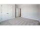 Bright bedroom features neutral walls and plush gray carpet at 4021 Grace Pointe Dr # 104, Wesley Chapel, NC 28079