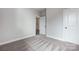 Bright bedroom with neutral walls, gray carpet, and base trim at 4021 Grace Pointe Dr # 104, Wesley Chapel, NC 28079