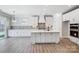 Bright kitchen with white cabinetry, a large island, modern appliances, and stylish backsplash at 4021 Grace Pointe Dr # 104, Wesley Chapel, NC 28079