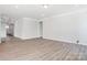 Expansive living space with hardwood flooring, neutral walls, and natural light at 4021 Grace Pointe Dr # 104, Wesley Chapel, NC 28079