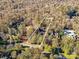 Aerial shot of the expansive lot with wooded surround, showcasing the property's natural beauty and privacy at 6040 Oxfordshire Rd, Waxhaw, NC 28173