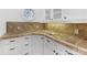 Butler's pantry with granite counter, mosaic backsplash, and ample cabinetry at 6040 Oxfordshire Rd, Waxhaw, NC 28173