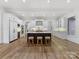 Spacious kitchen featuring an island with seating, stainless steel appliances, and custom cabinets at 6040 Oxfordshire Rd, Waxhaw, NC 28173