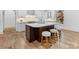 Bright kitchen featuring an island with seating, stainless steel appliances, and custom cabinets at 6040 Oxfordshire Rd, Waxhaw, NC 28173