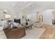 Spacious living room with a fireplace, built-in cabinets, and arched doorways at 6040 Oxfordshire Rd, Waxhaw, NC 28173