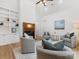 Bright living room featuring a fireplace, hardwood floors, and comfortable seating at 6040 Oxfordshire Rd, Waxhaw, NC 28173