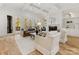 Bright living room with a fireplace, built-in shelving, and french doors leading to a deck at 6040 Oxfordshire Rd, Waxhaw, NC 28173