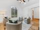 Cozy sitting area with a large window, comfortable chairs, and hardwood flooring at 6040 Oxfordshire Rd, Waxhaw, NC 28173