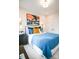 Bedroom with a blue comforter, plenty of light, and modern decor at 7928 Cedarsmith Ct, Charlotte, NC 28217
