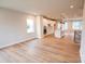 Open-concept living space featuring hardwood floors, recessed lighting, and a modern kitchen at 7928 Cedarsmith Ct, Charlotte, NC 28217