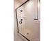 Glass enclosed shower featuring marble tiling, a built-in shelf, and matte black hardware at 7928 Cedarsmith Ct, Charlotte, NC 28217
