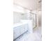 Luxurious bathroom featuring marble floors, double vanity, and a glass-enclosed shower at 7940 Cedarsmith Ct, Charlotte, NC 28217
