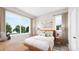 Cozy bedroom with a bed, nightstands, and large windows at 7940 Cedarsmith Ct, Charlotte, NC 28217
