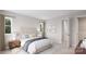 Bright bedroom with a bed, nightstand, and access to a closet at 7940 Cedarsmith Ct, Charlotte, NC 28217