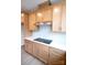 Close up of a kitchen featuring wood cabinetry and sleek countertops at 7940 Cedarsmith Ct, Charlotte, NC 28217