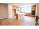 New kitchen featuring a large island, stainless appliances, and hardwood floors at 7940 Cedarsmith Ct, Charlotte, NC 28217