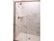 Stylish shower featuring marble walls, a modern shower head, and a glass enclosure at 7940 Cedarsmith Ct, Charlotte, NC 28217