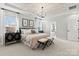 Bright and airy main bedroom with patterned ceiling, a cozy bed, and ensuite bathroom access at 110 Goorawing Ln, Mooresville, NC 28115