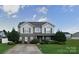 Charming two-story home with landscaped yard and welcoming entrance at 125 Mallory Tai Dr, Lincolnton, NC 28092