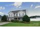 Well-maintained home with mature landscaping and manicured lawn at 125 Mallory Tai Dr, Lincolnton, NC 28092