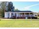 Brick ranch house with a covered porch and a well-maintained lawn at 150 Wilson St, Chester, SC 29706