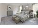 Inviting neutral-toned main bedroom with a plush bed, soft carpet, and natural light at 1602 Village Grove Ln, Monroe, NC 28110