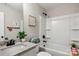 Bathroom featuring a granite-look countertop, black hardware, and shower over tub at 2411 Datsun Ave, Concord, NC 28027