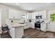 Well-equipped kitchen featuring granite counters, white cabinets, stainless steel appliances, and breakfast bar at 2411 Datsun Ave, Concord, NC 28027