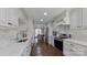 Well-equipped kitchen with white cabinets, quartz countertops, and stainless steel appliances at 4116 Tricia Ct, Monroe, NC 28110