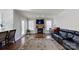 Living room with fireplace, hardwood floors, and access to back deck at 4116 Tricia Ct, Monroe, NC 28110