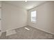 Cozy bedroom with carpet, a window with blinds, and neutral walls providing a serene atmosphere at 849 Blue Canyon Dr, York, SC 29745
