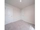 Neutral bedroom with two doors, plush carpet, and a source of natural light at 849 Blue Canyon Dr, York, SC 29745