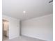 Large room with neutral walls and carpet with an adjacent bathroom visible through doorway at 849 Blue Canyon Dr, York, SC 29745