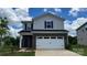 Charming two-story home with a brick and vinyl facade, complemented by a two-car garage and well-manicured lawn at 849 Blue Canyon Dr, York, SC 29745