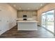 Open kitchen featuring a large island, gray cabinets, stainless steel appliances, and sliding glass doors at 849 Blue Canyon Dr, York, SC 29745