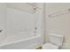 Full bathroom with white tub with shower and toilet at 8505 Loxton Cir, Charlotte, NC 28214