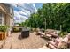 Brick patio perfect for outdoor entertaining with string lights and comfortable seating at 9618 Belloak Ln, Waxhaw, NC 28173