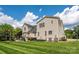 Expansive backyard showcasing lush green lawn, outdoor seating, and mature trees at 9618 Belloak Ln, Waxhaw, NC 28173