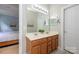 Bathroom with double vanity, large mirror, and neutral finishes at 9618 Belloak Ln, Waxhaw, NC 28173