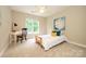 Bedroom with desk, single bed, carpet and neutral walls at 9618 Belloak Ln, Waxhaw, NC 28173