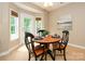 Cozy dining area with natural light, hardwood floors, and a warm ambiance at 9618 Belloak Ln, Waxhaw, NC 28173