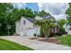 Charming home featuring an attached two-car garage, well-manicured lawn, and a basketball hoop at 9618 Belloak Ln, Waxhaw, NC 28173
