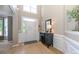 Bright foyer with soaring ceilings, white trim, and stylish console table with decorative accents at 9618 Belloak Ln, Waxhaw, NC 28173