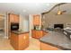 Eat-in kitchen with center island and view into living area at 9618 Belloak Ln, Waxhaw, NC 28173