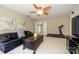 Comfortable living room featuring neutral walls, carpet and a seating area at 9618 Belloak Ln, Waxhaw, NC 28173