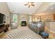 Inviting living room with a fireplace, plush seating, and natural light at 9618 Belloak Ln, Waxhaw, NC 28173