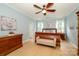 Spacious main bedroom with a ceiling fan, natural light, and hardwood flooring at 9618 Belloak Ln, Waxhaw, NC 28173